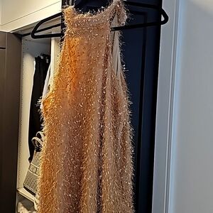 Sleeveless halter dress is gold size L